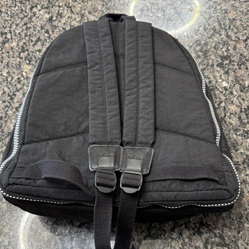 Kipling Hal Expandable Black Backpack with large Silver Accent zippers EUC